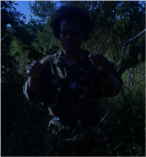 A member of The Black Mambas with a snare
