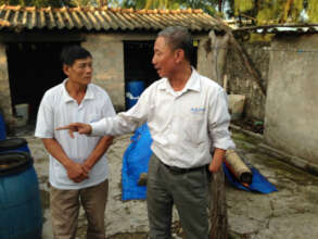 Thuan the AEPD outreach worker advises Mr Duc