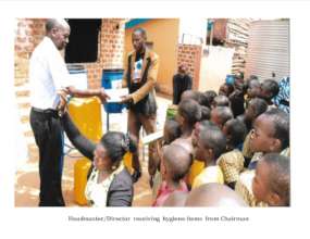 Chairman of  NECEA  giving out hygiene items
