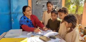 Manjula with children at School