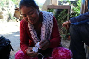 Village woman receiving solar training