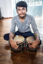 Nathann's happy to play the bongos!