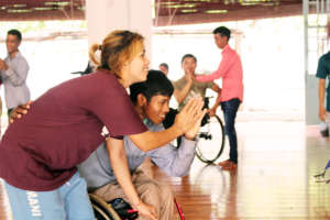 Performer, Mary, Leads a game with students