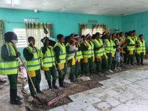 Byuka Girls working on the tiling floor