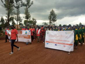 Gasabo residents and CM young mothers marching