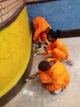 Project participants practicing painting skills