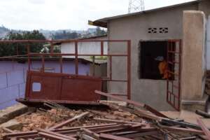 Workers moving materials for shelter renovation