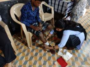 Medical team dressing a patients wound