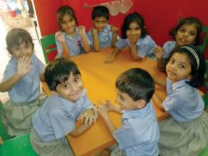 a group of children enjoying study
