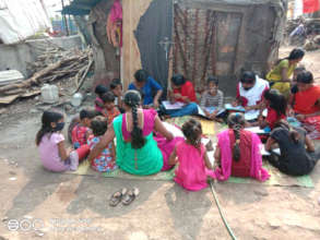 Teachers teaching street children in their areas