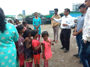 Visitor interacting with children