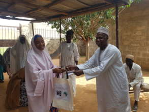 BOT Member handing over the soft grant