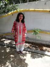 Ambreen with her moringa tree