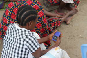 Rural Woman listening to the MP3forLife Player