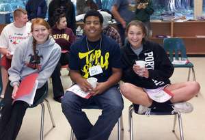 Leigh High School students with song books in hand
