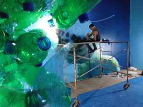 Garrick Marchena working on his mural
