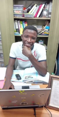 Bilal in the office at Kookaburra Community School