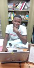 Bilal in the office at Kookaburra Community School