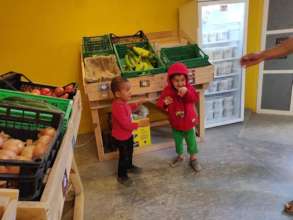 Two girls enjoying some fresh fruit