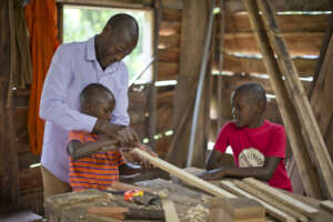 Boys showcasing their carpentry skills