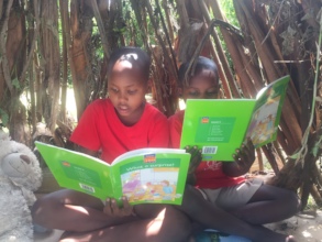 kids enjoying carefully selected books by OKAS