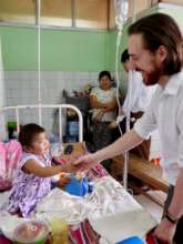 Mark McGuinness meeting a young patient