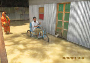 Person with Disabilities are in  Flood water.