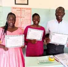 Handing out certificates to trained teachers