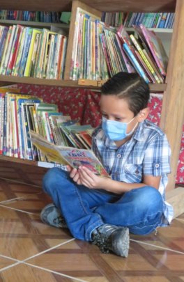 Elvin reading in StS school library