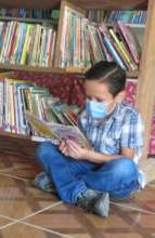 Elvin reading in StS school library