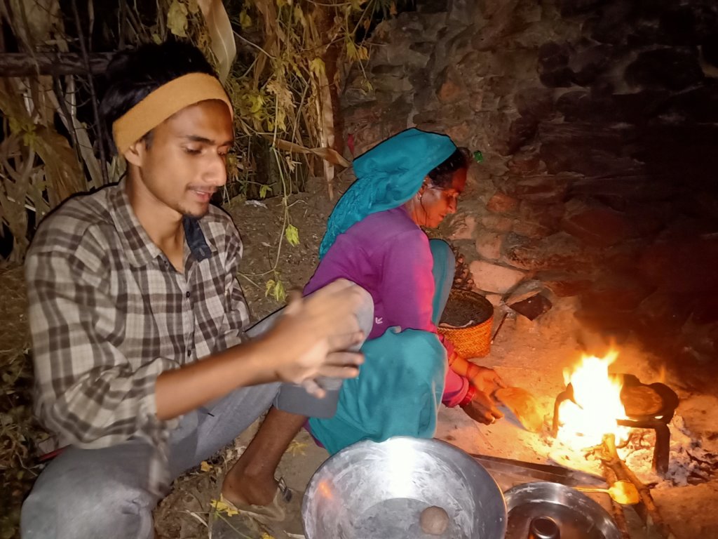 Santosh helps his mother prepare food