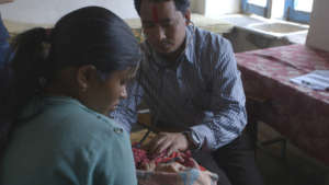 Lalit treats a sick baby