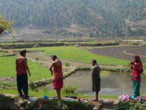 Girls wash in remote mountain village