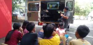 Teaching street kids about proper waste disposal.