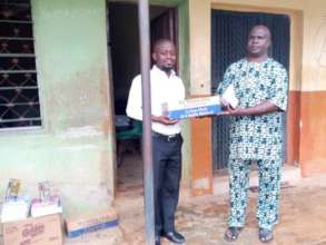 Presentation of Boxes of Chalks to the Principal