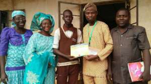 Amb. Goodness flanked by his teachers & ISERH Dir.