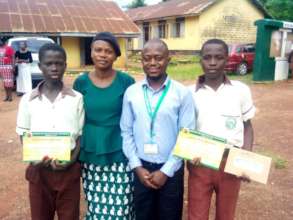 ISERH PD flanked by the Ambassadors & a teacher