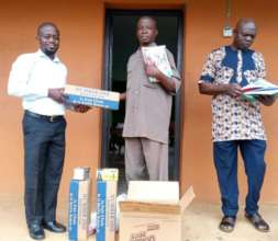 Principal Receiving Donated Cartons of Chalks