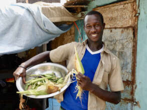 Beneficiary with his home grown produce