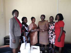 PRESENTING CHEQUE TO THE VICTIM OF FIRE ACCIDENT