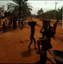 Residents including children fetching water