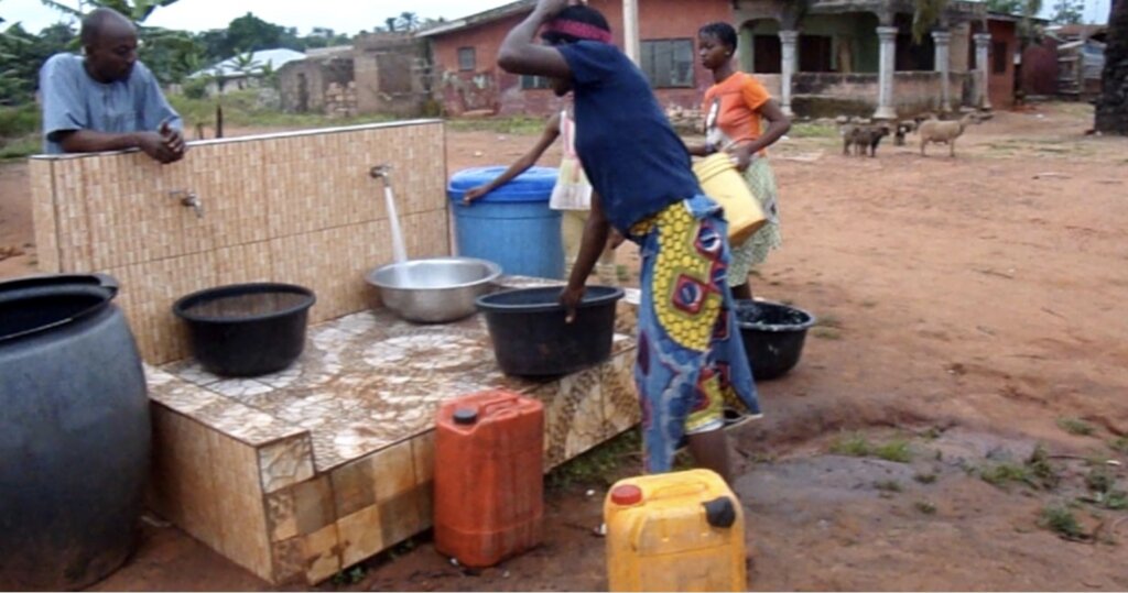 Children fetching water from our facility in Iyere