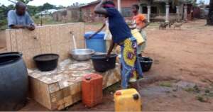 Children fetching water from our facility in Iyere