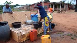 Residents fetching water during community visit