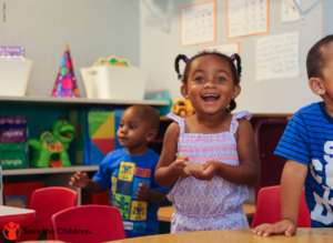Kennedy smiles for the camera at her daycare in TX
