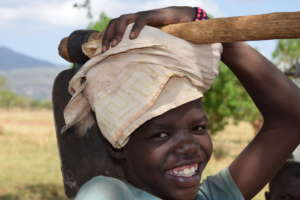 Young girl returning from her work in the field