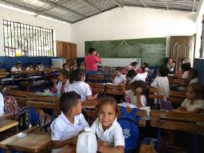 The students enjoying their new desks