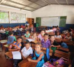 Students in their new school and new desks
