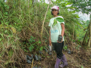 Community member with seedling