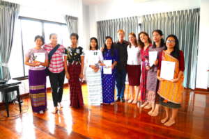 Students pose with their Graduation Certificates